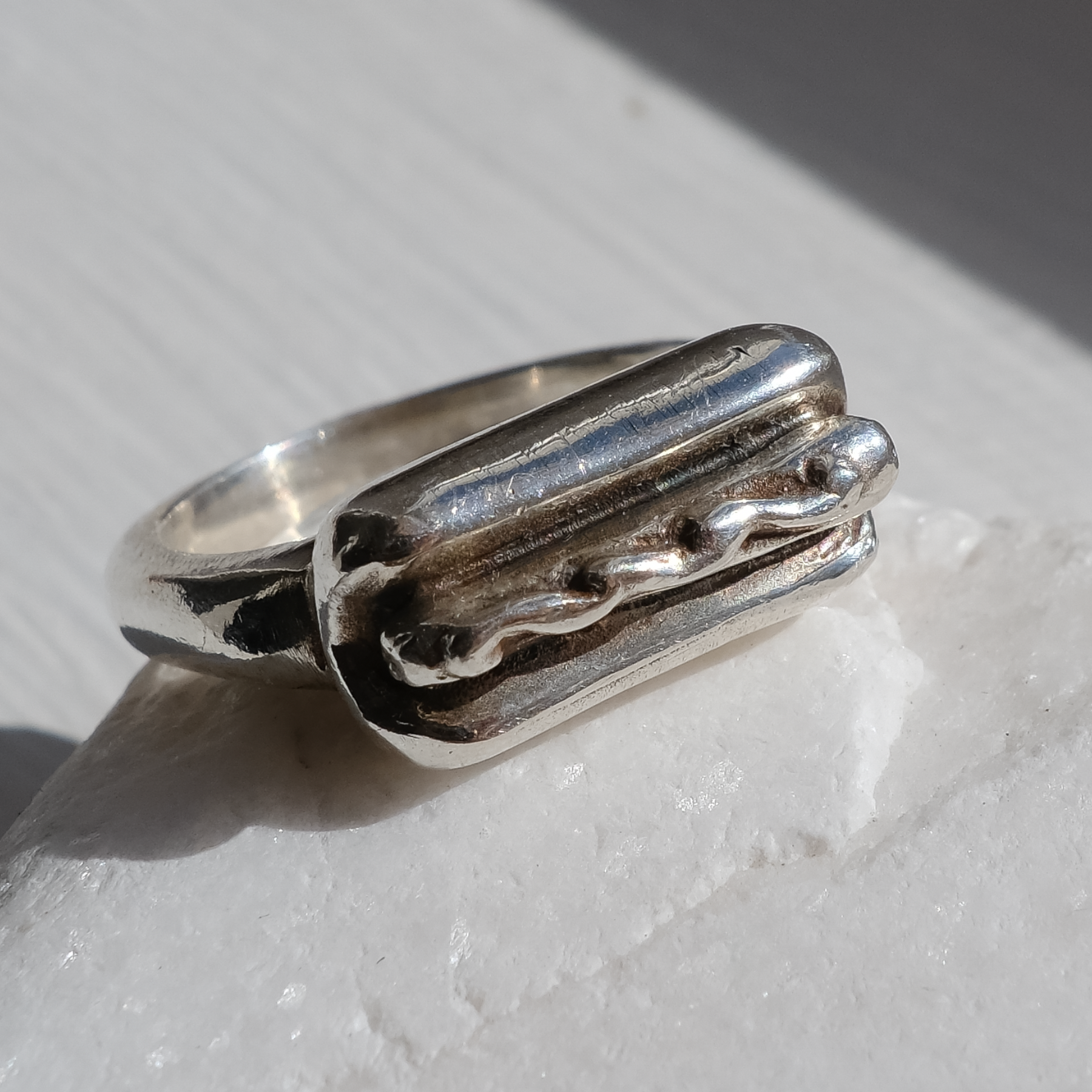 Hot Dog ring with a on a light surface